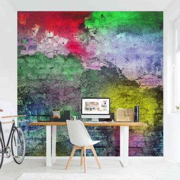 Fotobehang Colourful Sprayed Old Brick Wall
