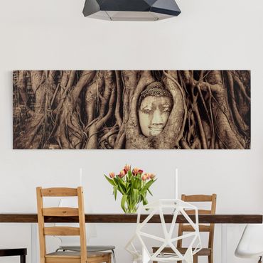 Canvas schilderijen Buddha In Ayutthaya Lined From Tree Roots In Black And White