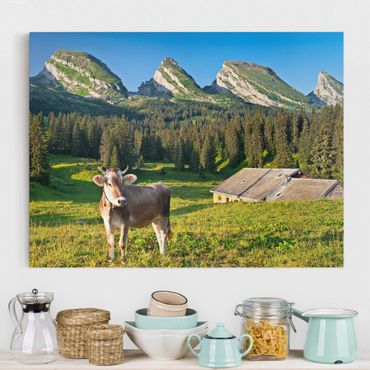 Canvas schilderijen Swiss Alpine Meadow With Cow
