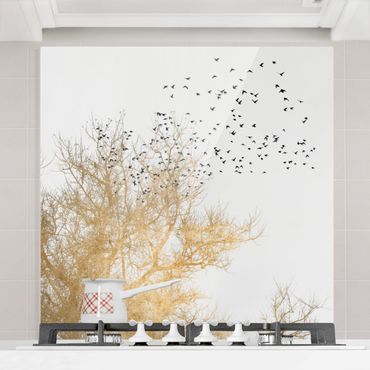 Spatscherm keuken Flock Of Birds In Front Of Golden Tree