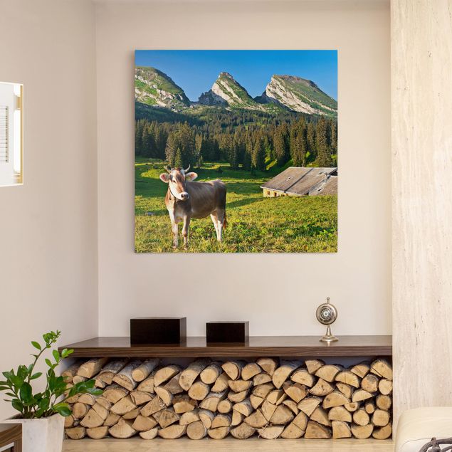 Canvas schilderijen Swiss Alpine Meadow With Cow
