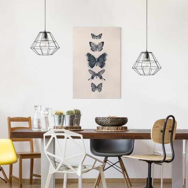 Canvas schilderijen Ink Butterflies On Beige Backdrop