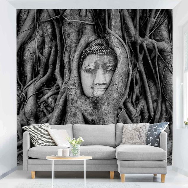 Fotobehang Buddha In Ayutthaya Lined From Tree Roots In Black And White