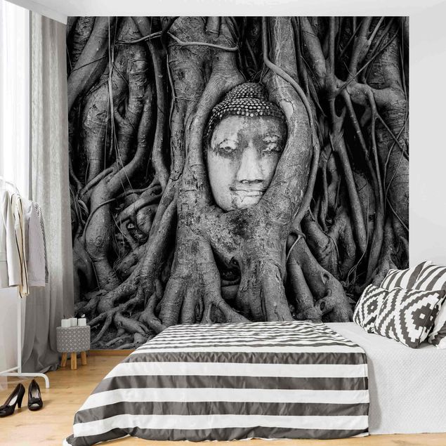 Fotobehang Buddha In Ayutthaya Lined From Tree Roots In Black And White